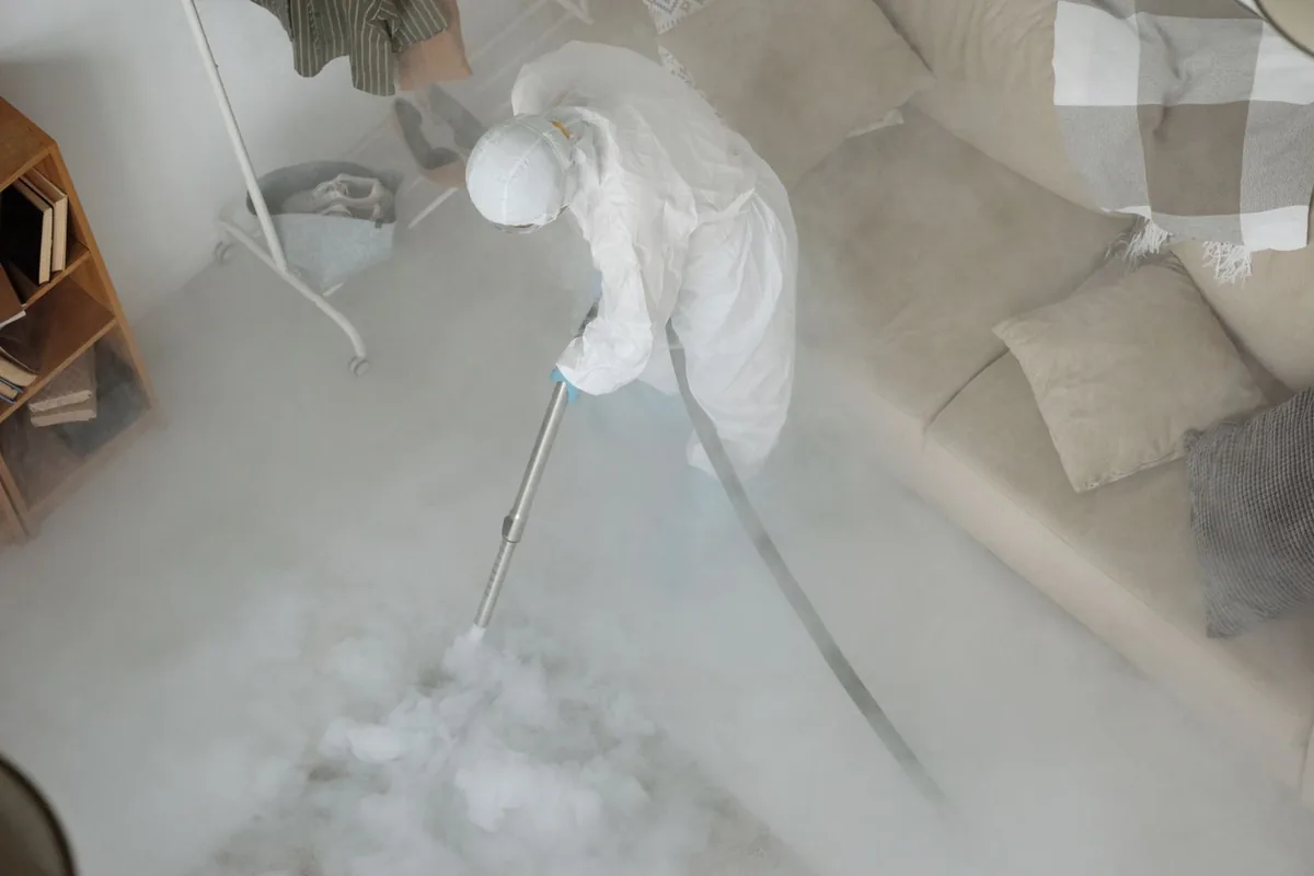 Biohazard cleanup technician in protective equipment, Eunice, LA